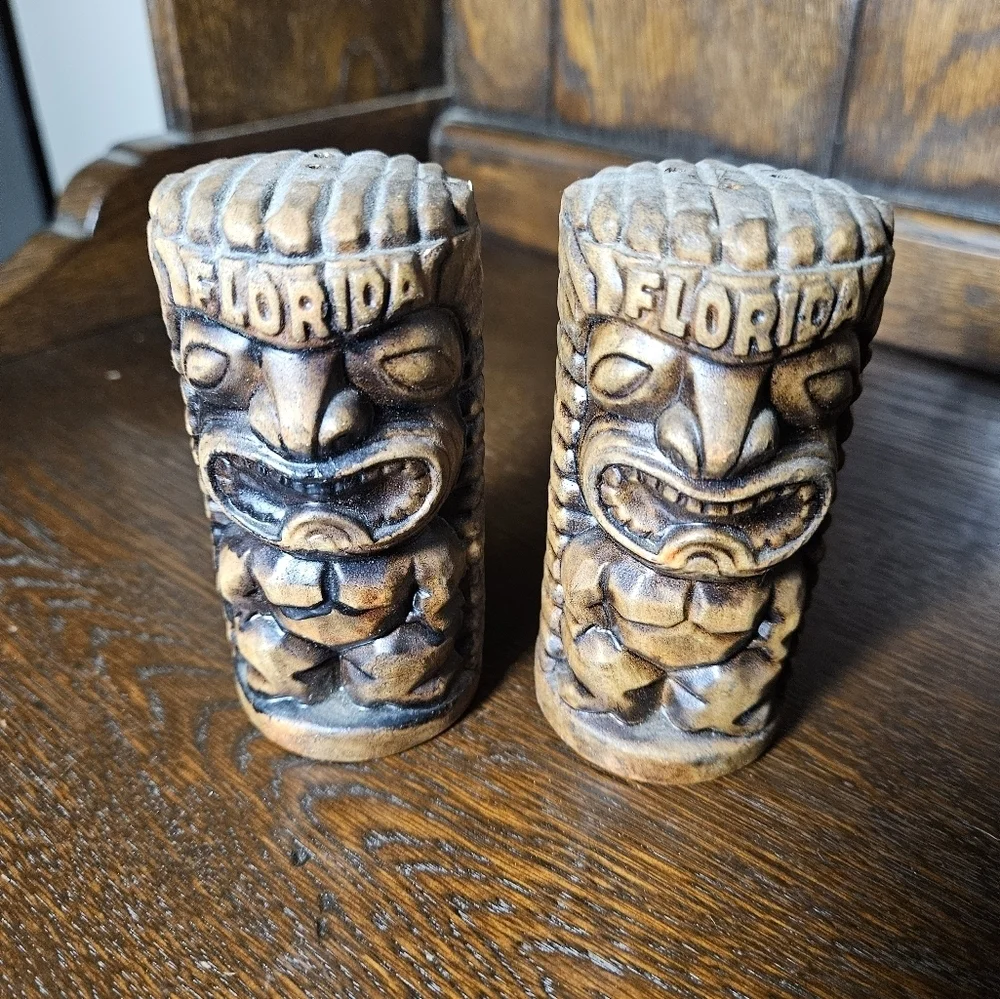 Set of vintage Florida ceramic tiki salt and pepper shakers.